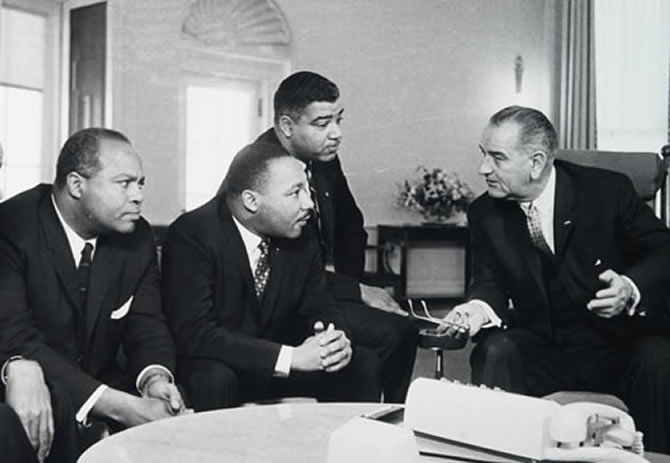 President Lyndon Johnson speaking with civil rights leaders.